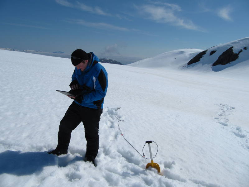 Phil setting up a new dipole antenna to try communications with the subglacial probes